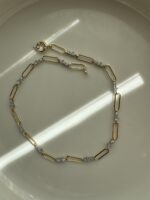 Gold renk taş detaylı ataç kolye