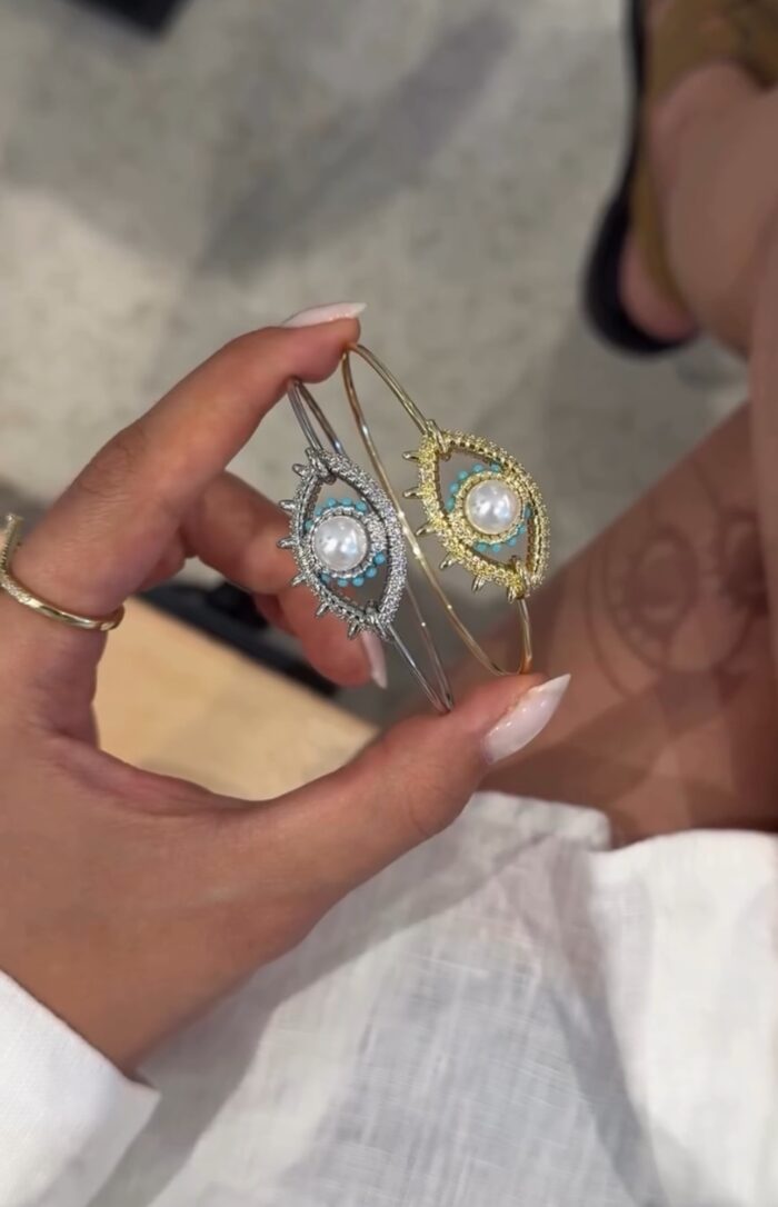 Gold renk ortası inci detaylı göz kelepçe bileklik